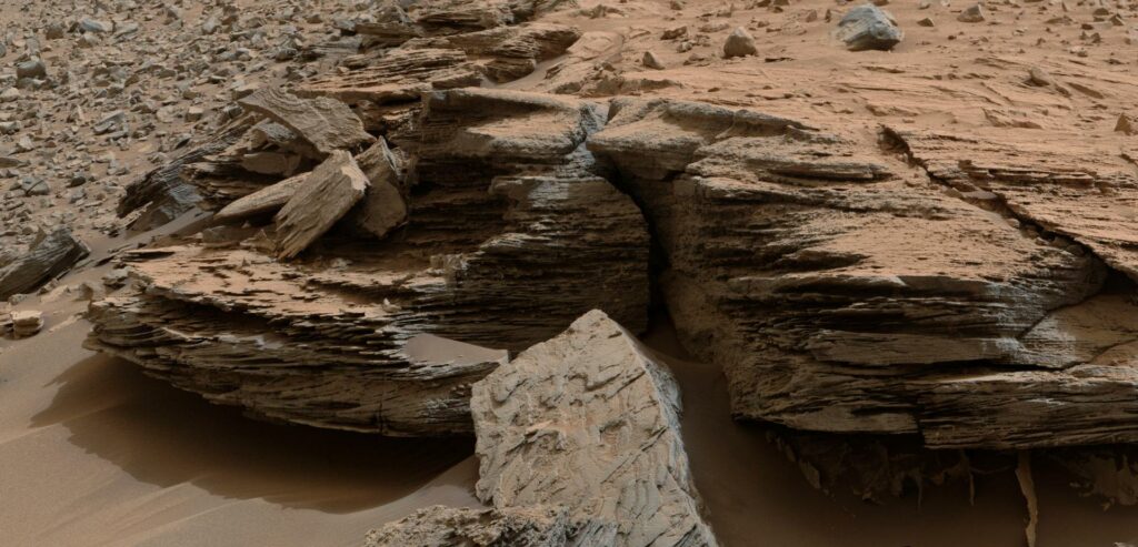 This view from the NASA Curiosity Mars rover shows an example of cross-bedding that results from water passing over a loose bed of sediment. It was taken at a target called Whale Rock within the Pahrump Hills outcrop at the base of Mount Sharp. Credit: NASA/JPL-Caltech/MSSS