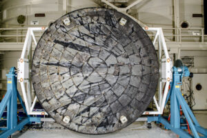 After NASA’s Orion spacecraft was recovered at the conclusion of the Artemis I test flight and transported to NASA’s Kennedy Space Center in Florida, its heat shield was removed from the crew module inside the Operations and Checkout Building and rotated for inspection. Credit: NASA