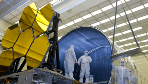 BALL AEROSPACE TECHNICIANS REMOVE FINAL SIX JWST MIRRORS TESTED AT MSFC X-RAY AND CRYOGENIC FACILITY. Credit: EMMETT GIVEN