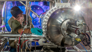 NASA Glenn Technician Mark Springowski works on a 10-kilowatt Stirling Power Conversion Unit, which is part of the Fission Surface Power Technology Demonstration Unit. This is a system level demonstration of a surface power system, which could potentially be used to support manned missions to the moon or Mars. A flight system would use 180 kilowatt nuclear fission reactor and four Stirling PCU’s to produce 40 kW of electricity for manned surface missions. Credit: NASA