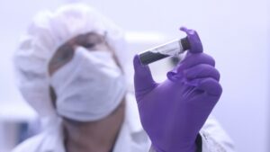 In this video frame, Jason Dworkin holds up a vial that contains part of the sample from asteroid Bennu. Dworkin is the mission's project scientist at NASA's Goddard Space Flight Center in Greenbelt, Maryland. Credit: NASA/James Tralie