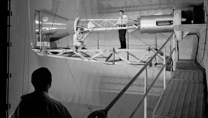 A Mercury capsule is mounted inside the Altitude Wind Tunnel for a test of its escape tower rockets at the National Aeronautics and Space Administration (NASA) Lewis Research Center. Credit: NASA