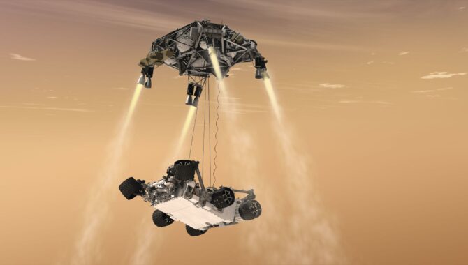 This artist's illustration shows the sky crane maneuver that delivered NASA's Curiosity rover to the surface of Mars in 2012, concluding what is known as the “seven minutes of terror”—the nail-biting descent through the thin Martian atmosphere. Credit: NASA